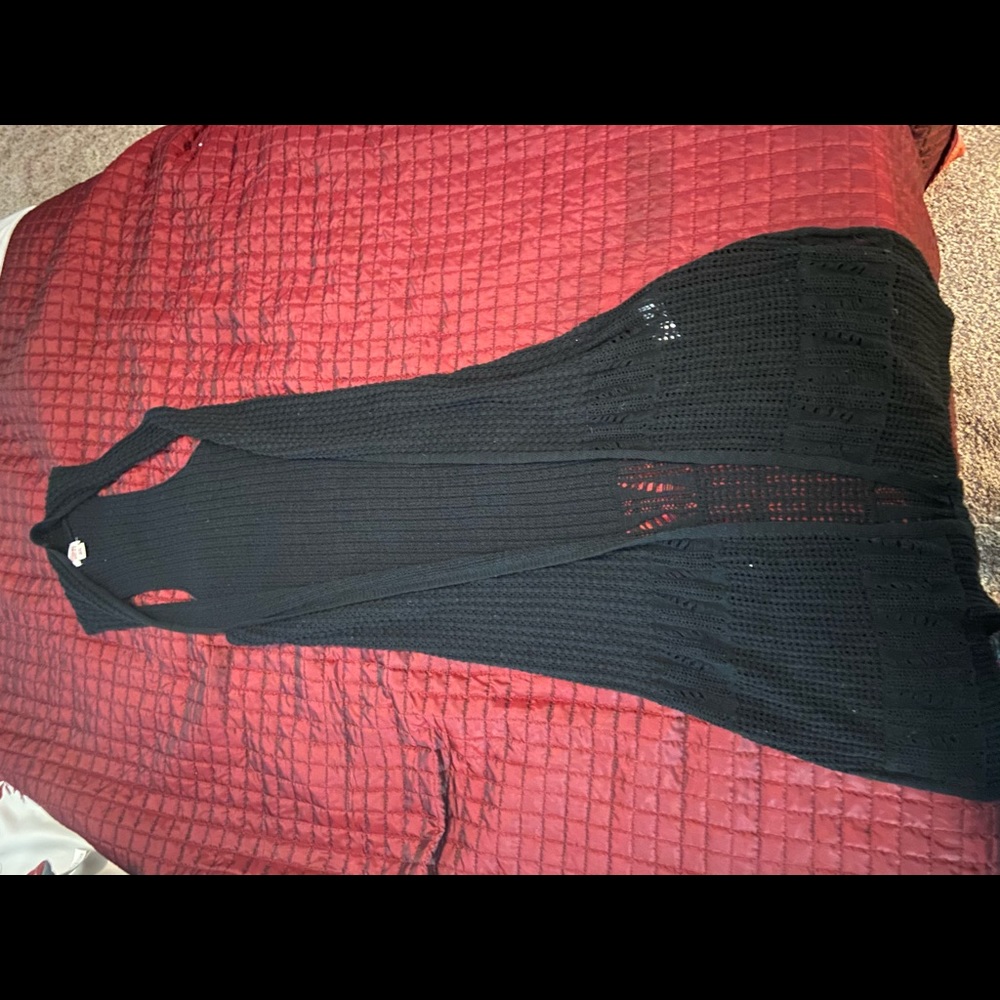 Black sleeveless duster